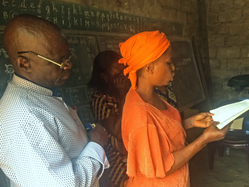 Claudine Lutondo of Kinshasa reads the Bible in Lingala. Photo provided by AIMM.