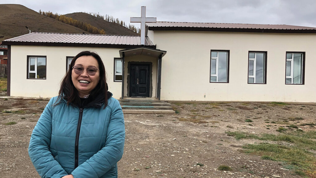 Pastor Oogii in front of the Terelj Christian Church. — Sister Care