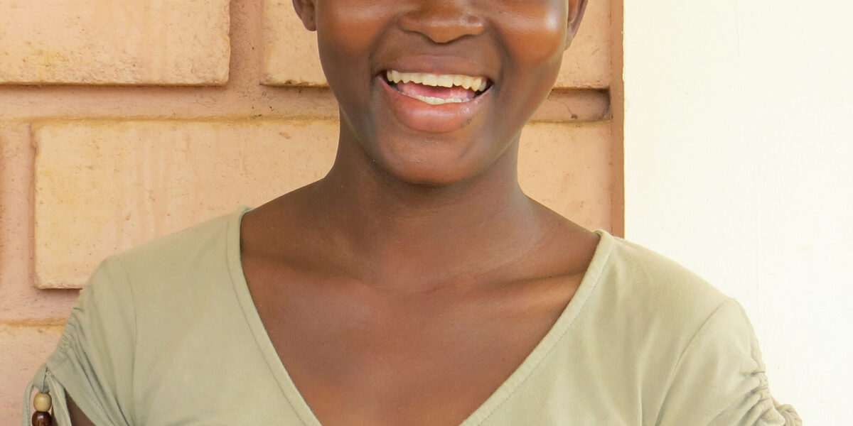 Mawuli  talks about how God used La Casa Grande in Benin to give her hope and a future. Photo by Lynda Hollinger-Janzen. Download full-resolution image.