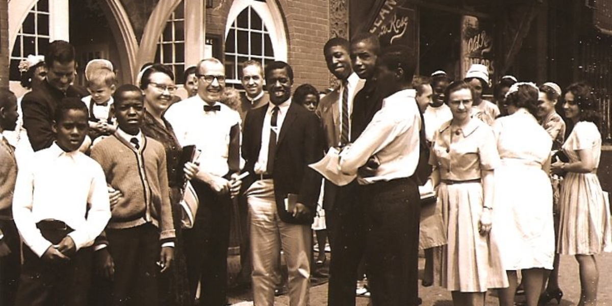 ​From left to right (in the middle of the picture) is the late Ethel M. Zeager (wearing a covering and glasses and holding a Bible)