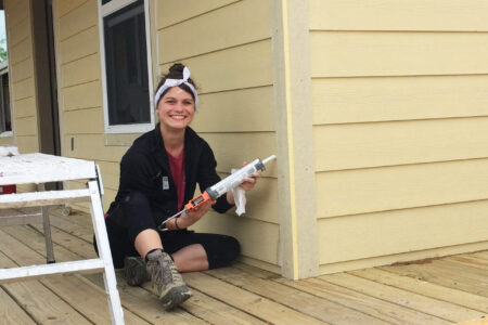 Sara Schowalter from Colorado Springs service Adventure unit, caulking siding