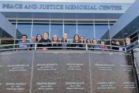 ​EMS Youth Venture E-term participants stand at the Peace and Justice Memorial Center in Montgomery