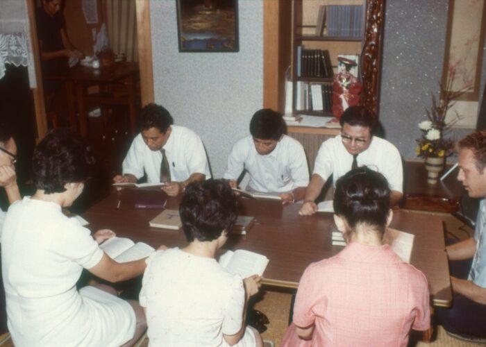 On right, Carl Liechty in an English language Bible study in December 1973 Kagashima, Japan. Photo courtesy of Mennonite Church USA.