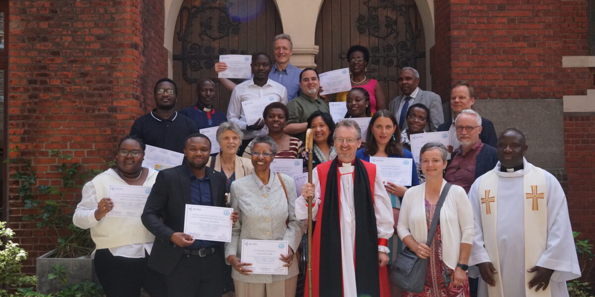 ​The first graduates of Holy Trinity Brussels' peace and conflict transformation program celebrate with Sharon Norton and Jean-Bosco Turahirwa (first row