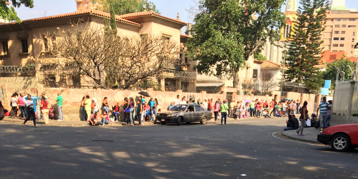 ​People wait in long lines for the chance to buy basic food staples. Photo provided by Marisa Smucker. Click on image for high resolution version.