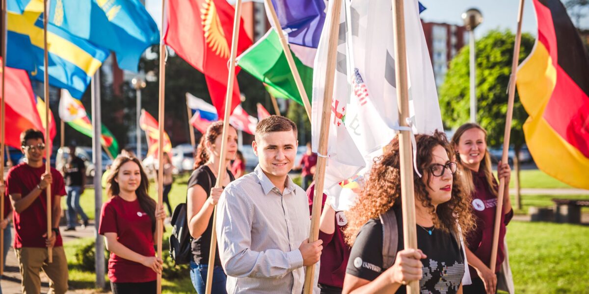 Some of LCC International University's students carry flags representing their home countries at the start of the 2021-22 academic year. Photo: LCC Corporate Communications Office