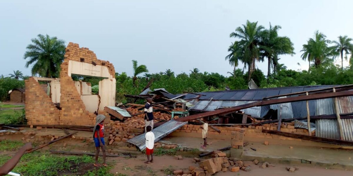 ​Children from Ndjoko Punda observe the damage to the Mennonite church caused by the Nov. 22 storm. Photo provided.