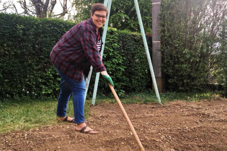 Kate Widmer works in her “confinement” garden in Béthoncourt