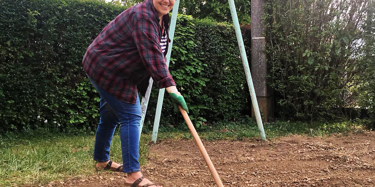 Kate Widmer works in her “confinement” garden in Béthoncourt