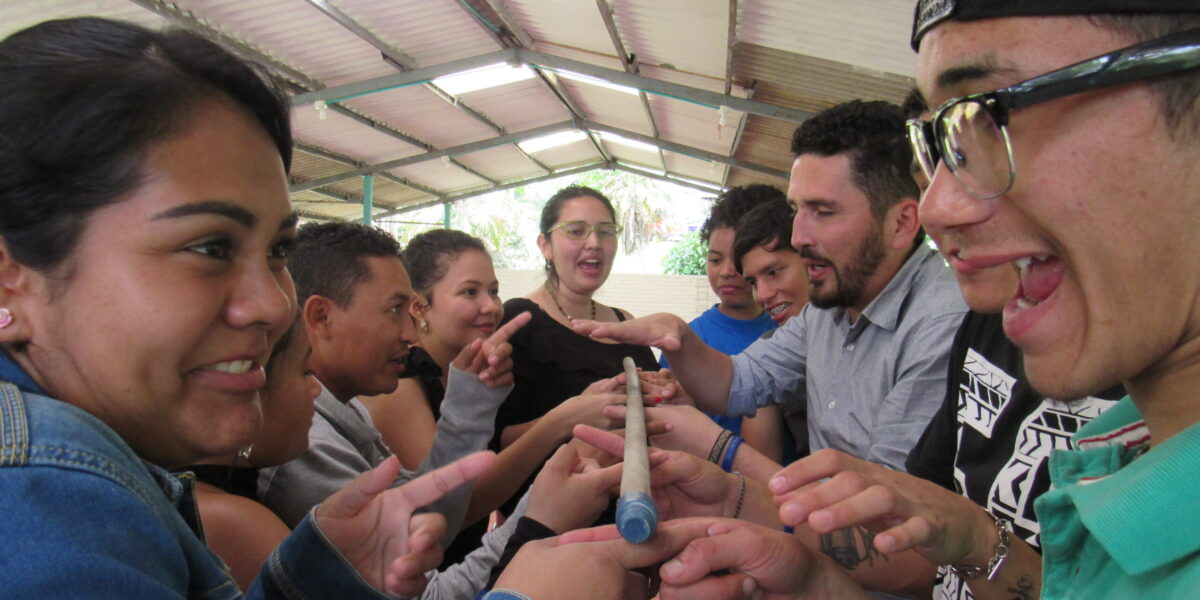 Colombian youth participate in team building fun: in the front is Linda Fabiola Fajardo (left) and Miyer Perez (right). Photo by Eric Frey Martin. 