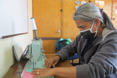 ​Yenny Rangel sews COVID-19 face masks at the Teusaquillo Mennonite Church in Bogotá