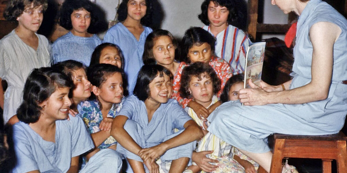 ​Mary Hope Wood Stucky shares Bible stories and prayer with the children at bedtime in the Cachipay