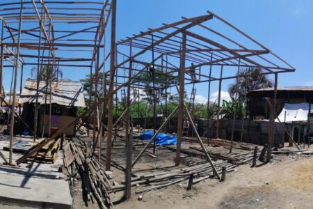 ​This panoramic view shows the five houses under construction and the street on Isla Iquitos