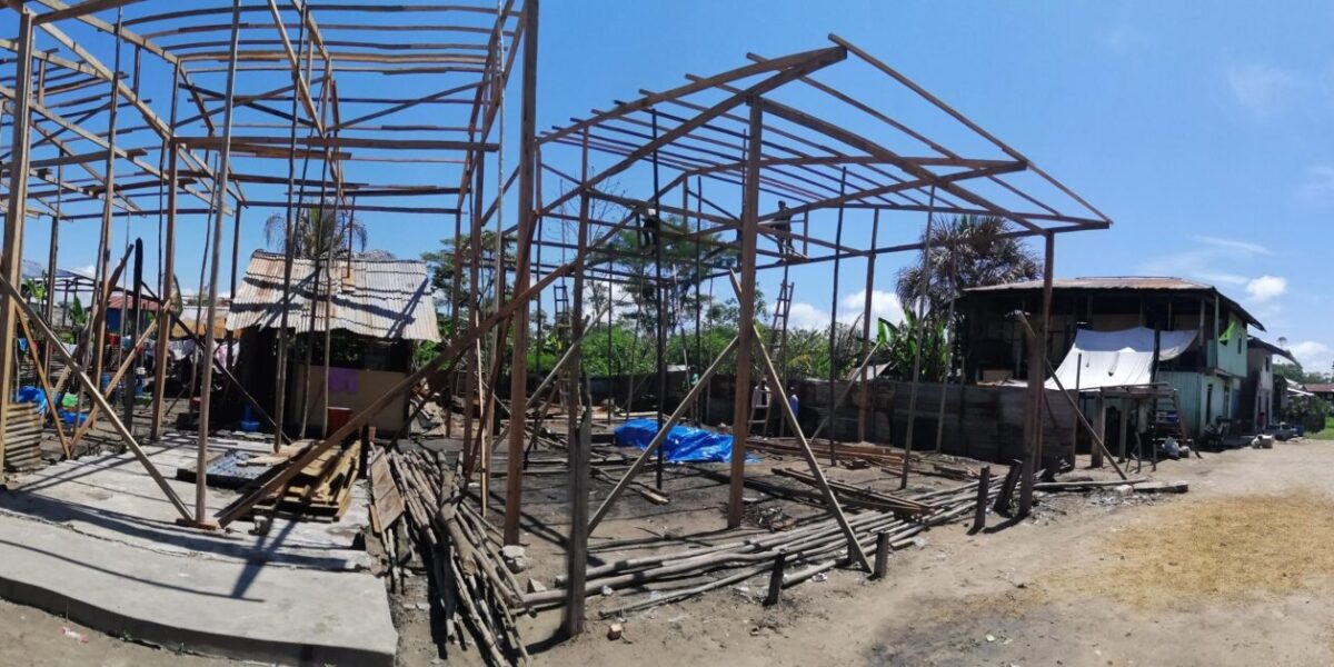 ​This panoramic view shows the five houses under construction and the street on Isla Iquitos