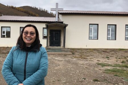 Pastor Oogii in front of the Terelj Christian Church. — Sister Care