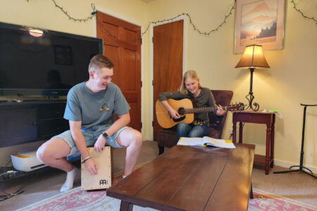 Josia Kämper and Anna Millsap lead music for worship night at the Service Adventure unit house in Jackson