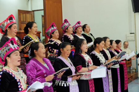 The women’s singing group of the Khun Klang church performs during a church service.