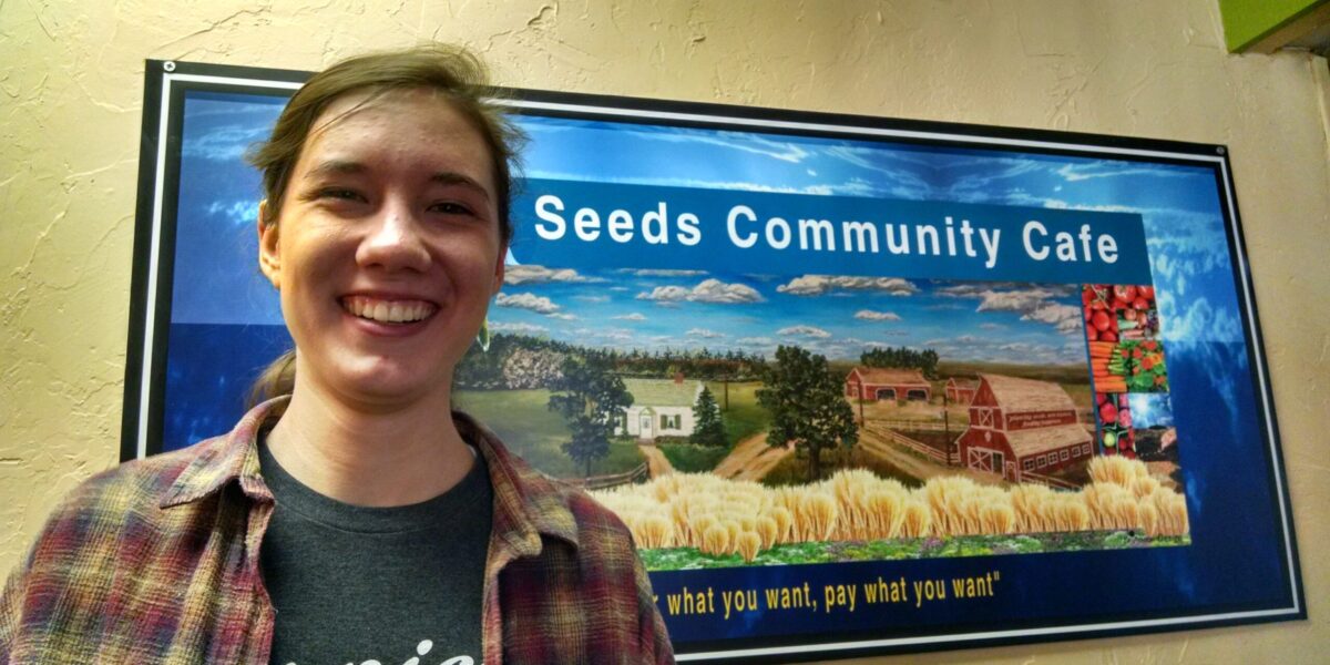 ​Anali North Martin stands outside her placement at Seeds Community Café. Picture taken by Susan Nisly. Click on image for high resolution version.