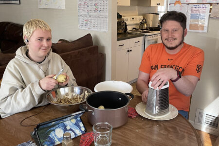 ​Nelly Sandersfeld and Travis Clarke (leader) making dinner at the Colorado Springs (Colorado) Service Adventure unit house. Photo by Shelby Clarke.