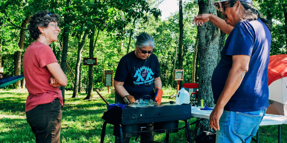 ​While Mary Mitchell cooks a Potawatomi meal for Trail of Death participants