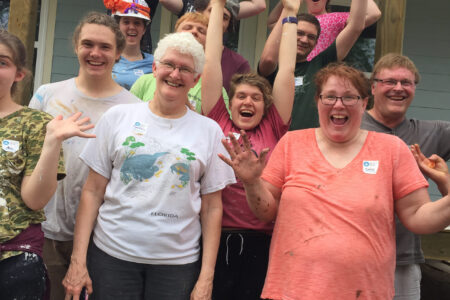 ​Service Adventure participants and leaders volunteered together working on home renovation in South Texas. From the left side of the front row to back row: Cynthia Neufeld Smith