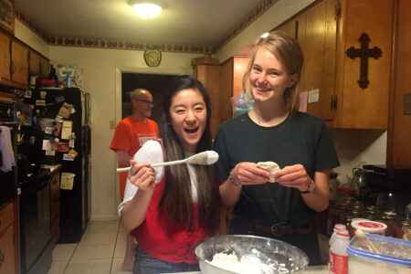 Risa Fukaya and Paula Klätte in the kitchen of their Service Adventure home in Jackson Mississippi.  Photo by Cynthia Neufeld Smith.