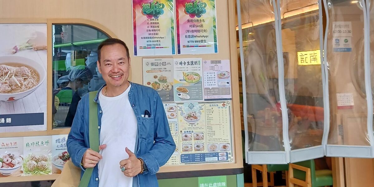 Andi Santoso standing in front of a restaurant